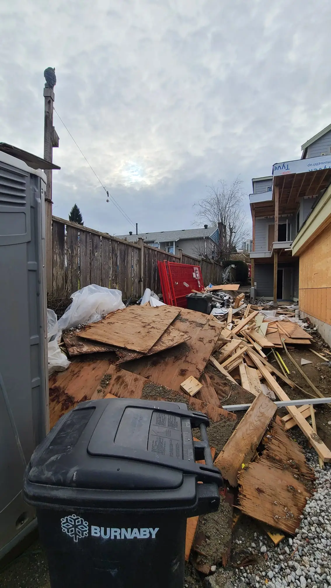Outdoor pile of discarded wood debris and trash removed by kinsley junk removal maple ridge
