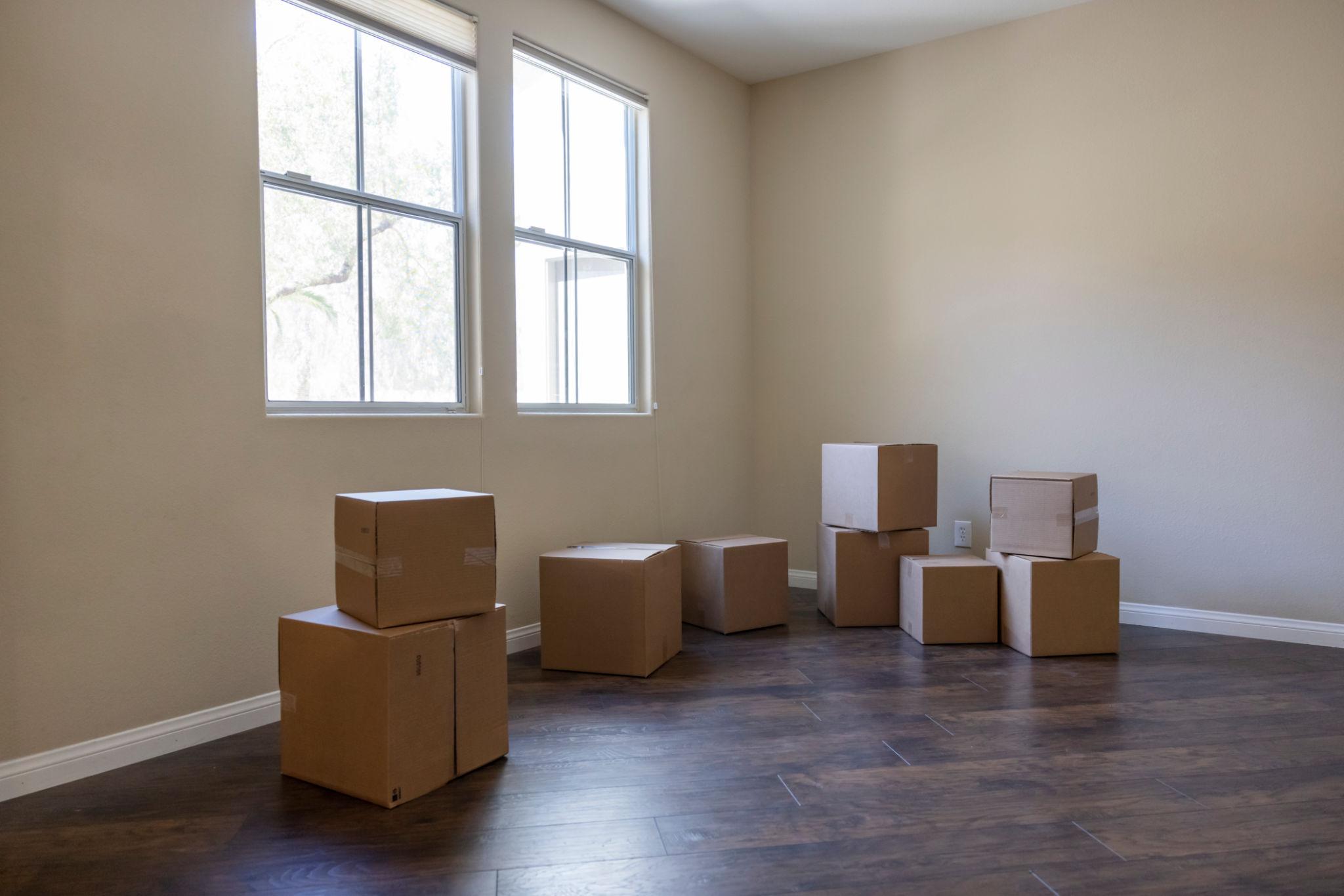 Clean uncluttered home with packed boxes ready for moving day