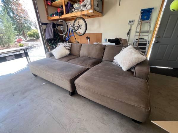 Old sofa ready for furniture removal from a Maple Ridge home